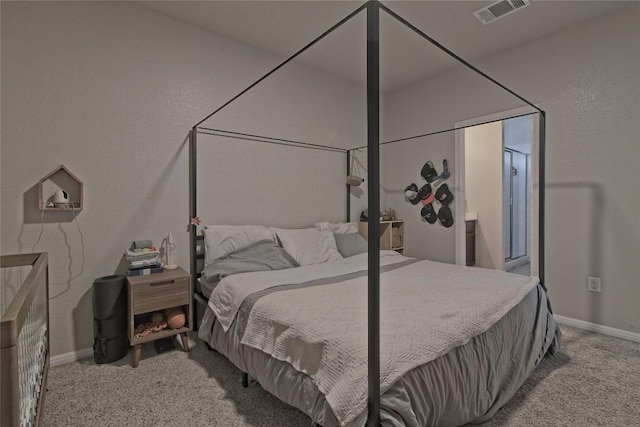 bedroom featuring baseboards, visible vents, and carpet flooring