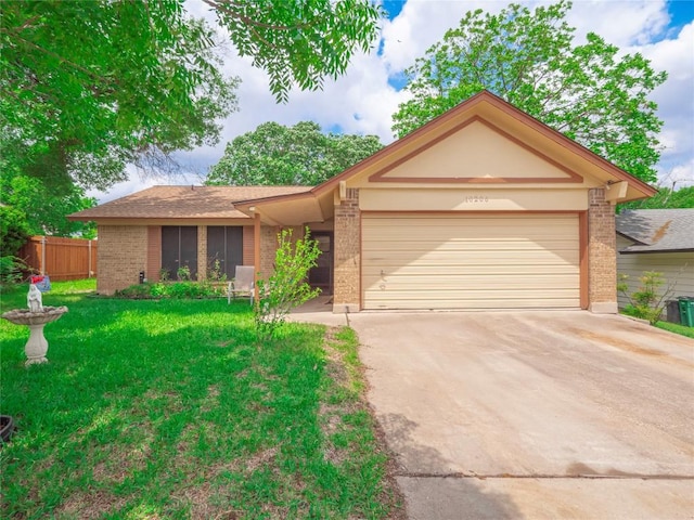 ranch-style home featuring a front yard, concrete driveway, and brick siding