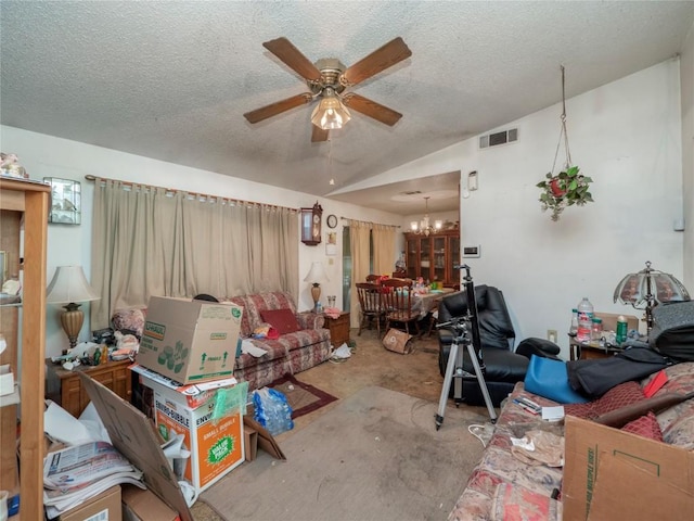 living room with concrete flooring, visible vents, vaulted ceiling, a textured ceiling, and ceiling fan with notable chandelier