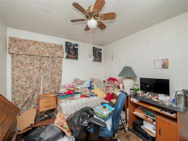 bedroom with a textured ceiling and a ceiling fan