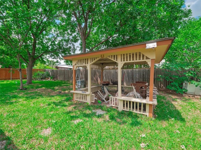 view of yard with a gazebo and a fenced backyard