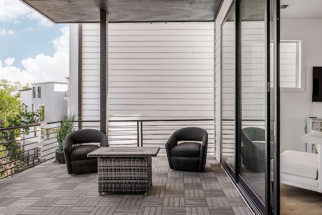view of patio with a balcony