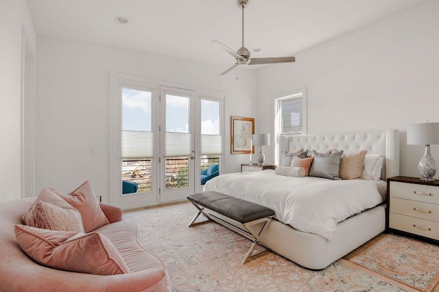 bedroom featuring access to exterior and a ceiling fan