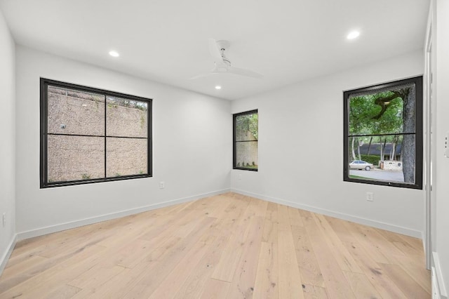 2001 Circle Hvn, Austin, TX 78741 - spare room featuring plenty of natural light, light wood-type flooring, recessed lighting, baseboards, and a ceiling fan
