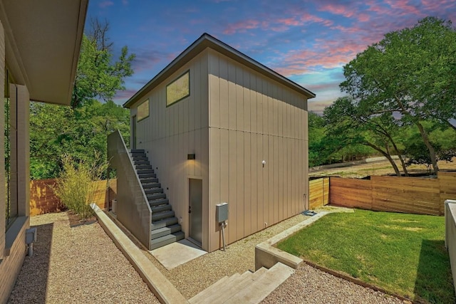 2001 Circle Hvn, Austin, TX 78741 - property exterior at dusk with stairway