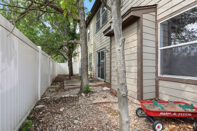 view of property exterior with a fenced backyard