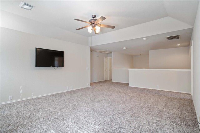 unfurnished living room with baseboards, visible vents, a ceiling fan, and carpet flooring