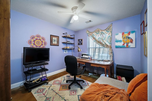 3011 Foxton Cv, Austin, TX 78748 - home office featuring ceiling fan, baseboards, and a textured ceiling