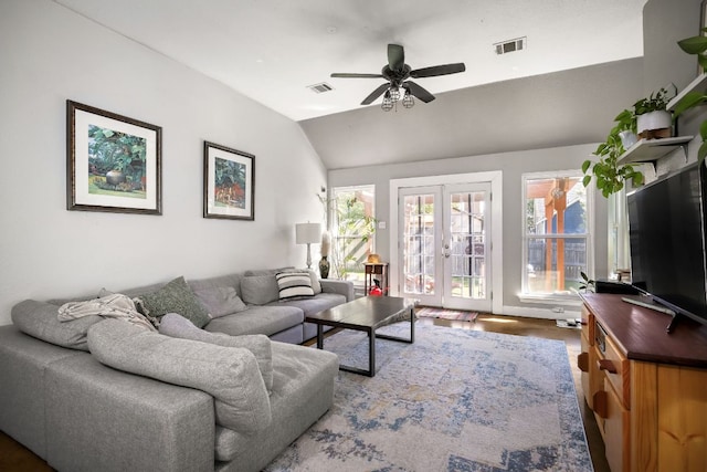 3011 Foxton Cv, Austin, TX 78748 - living area featuring french doors, vaulted ceiling, a ceiling fan, and wood finished floors