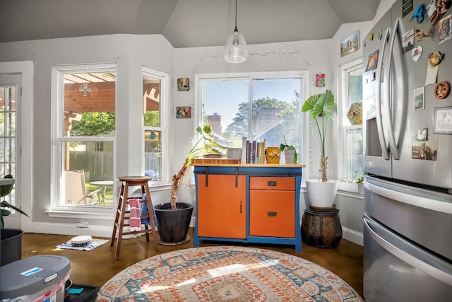 3011 Foxton Cv, Austin, TX 78748 - kitchen featuring stainless steel fridge with ice dispenser, lofted ceiling, healthy amount of natural light, baseboards, and pendant lighting
