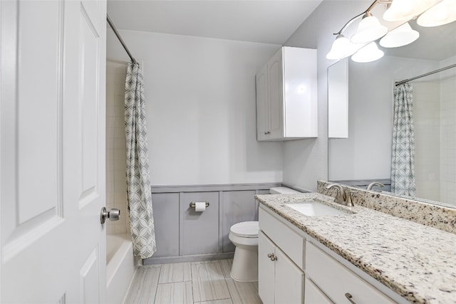 12600 Limerick Ave, Austin, TX 78727 - full bath featuring vanity, a wainscoted wall, and shower / bath combo with shower curtain