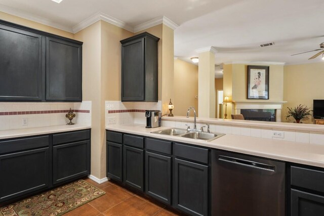 kitchen featuring tasteful backsplash, dishwasher, a sink, visible vents, and open floor plan
