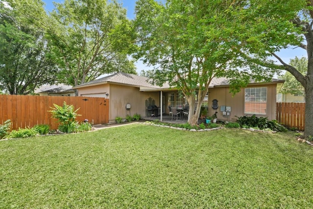 back of property with a yard, a patio area, and fence private yard