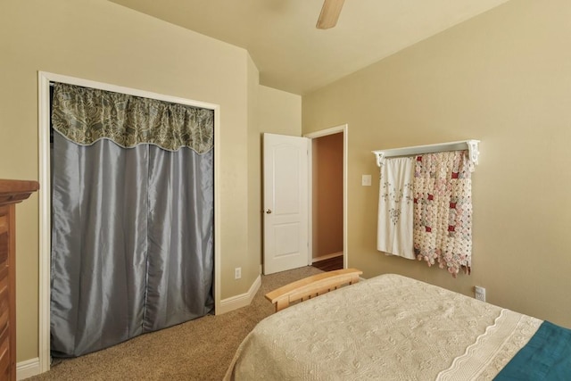 bedroom with a ceiling fan, carpet flooring, and baseboards