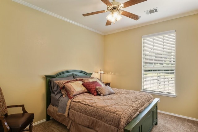 carpeted bedroom featuring visible vents, crown molding, baseboards, and multiple windows