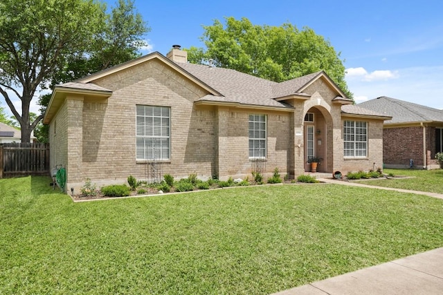 1028 Thackeray Ln, Pflugerville, TX 78660 - single story home featuring brick siding, a front lawn, fence, and a chimney