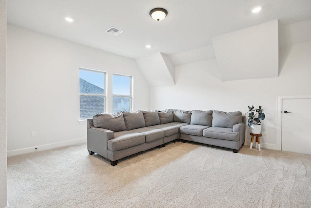 living area with light colored carpet and recessed lighting