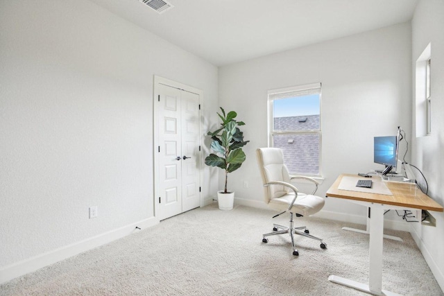 office area with visible vents, carpet, and baseboards