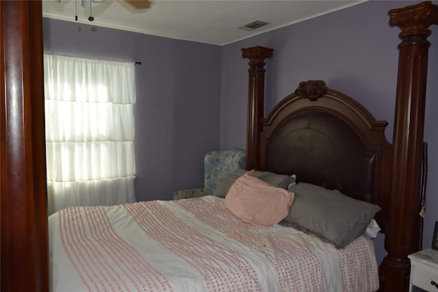 1200 NE 5th St, Smithville, TX 78957 - bedroom with crown molding, visible vents, and ceiling fan