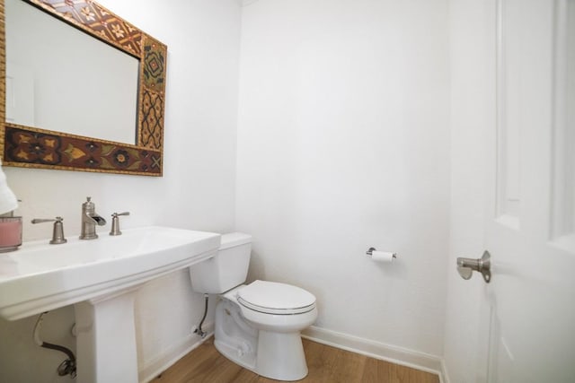 1702 Crested Butte Dr, Austin, TX 78746 - bathroom featuring wood finished floors and toilet