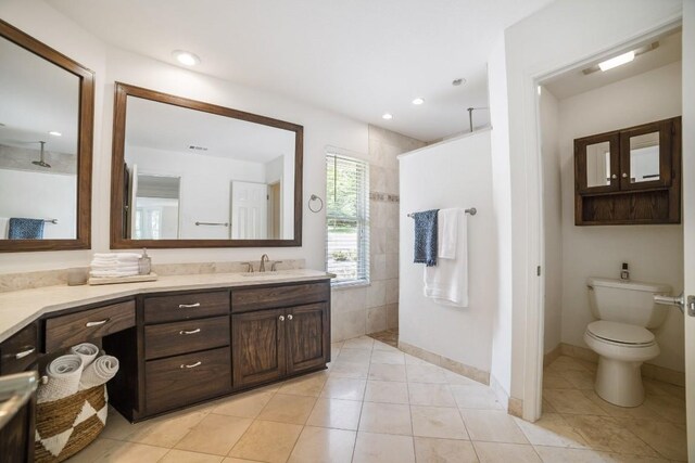 1702 Crested Butte Dr, Austin, TX 78746 - full bath featuring vanity, a walk in shower, tile patterned floors, and recessed lighting