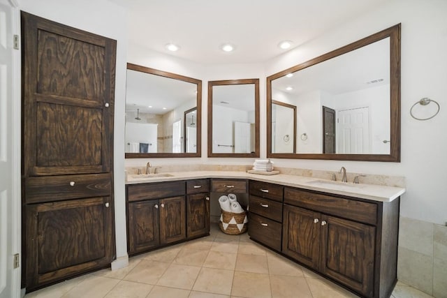 1702 Crested Butte Dr, Austin, TX 78746 - bathroom featuring double vanity, tile patterned flooring, and recessed lighting