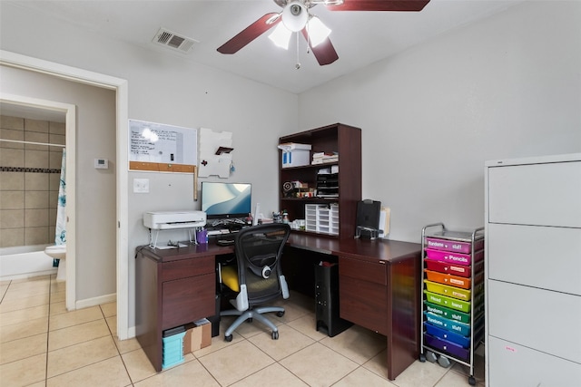 office space featuring light tile patterned floors, visible vents, and a ceiling fan