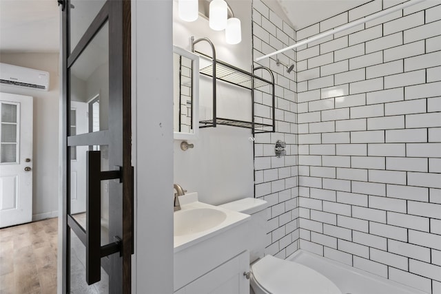 bathroom with a stall shower, toilet, wood finished floors, vanity, and a wall mounted air conditioner