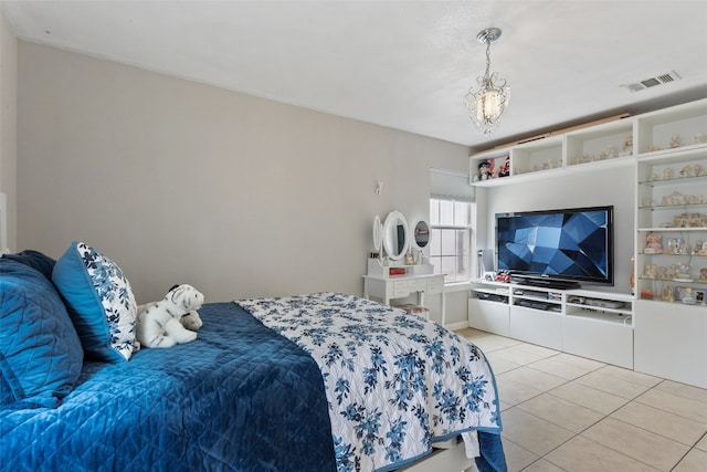 bedroom with light tile patterned floors and visible vents
