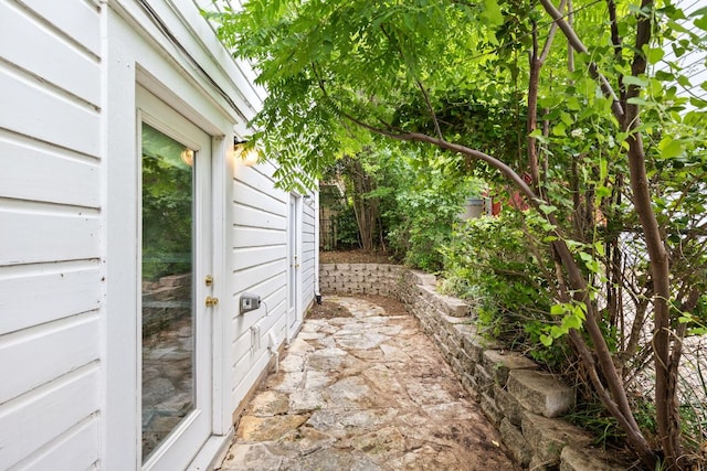 view of property exterior featuring a patio area