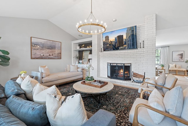129 The Hills Dr, The Hills, TX 78738 - living area with a chandelier, a fireplace, vaulted ceiling, a skyline view, and built in features