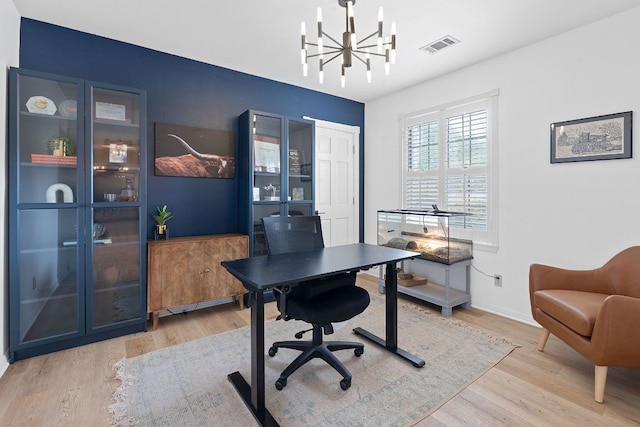 129 The Hills Dr, The Hills, TX 78738 - home office with wood finished floors, a chandelier, and baseboards