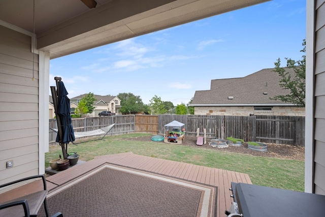 view of patio / terrace featuring a ceiling fan, a wooden deck, and a fenced backyard