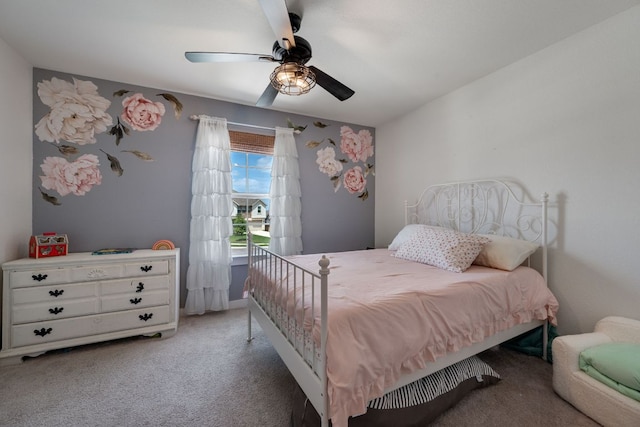 bedroom featuring a ceiling fan and light carpet