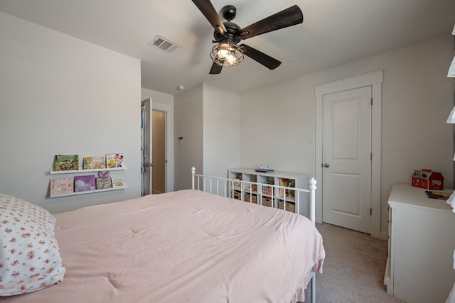 bedroom featuring visible vents, a ceiling fan, and light colored carpet