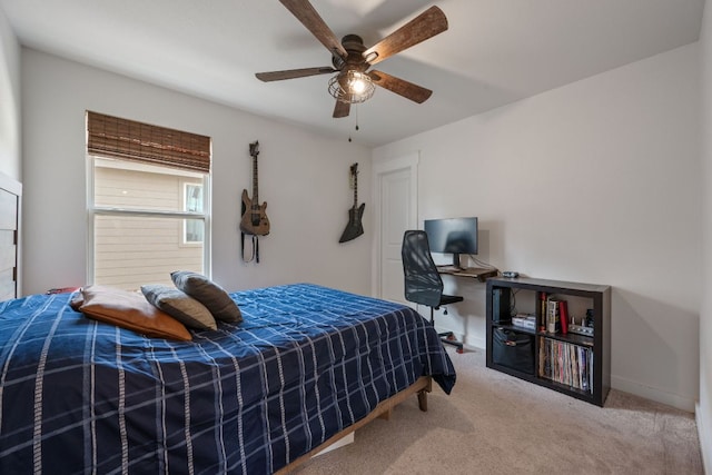 bedroom featuring a ceiling fan and carpet
