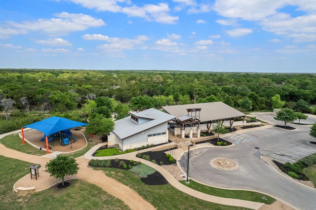 drone / aerial view featuring a view of trees