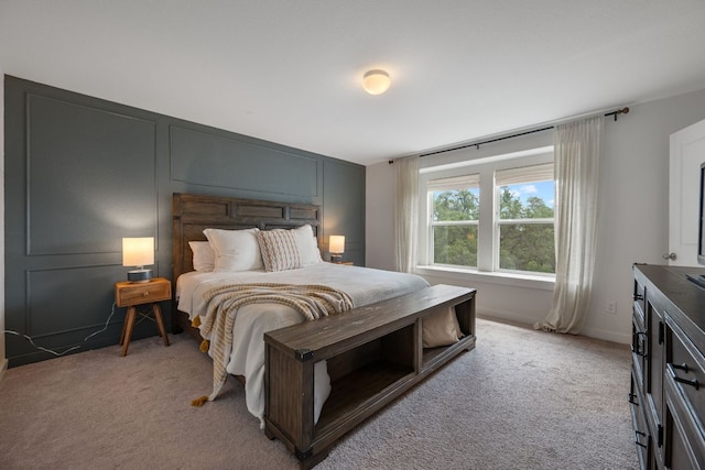 bedroom featuring light carpet