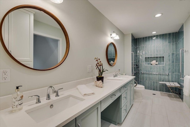 bathroom with a sink, toilet, recessed lighting, tile patterned flooring, and tiled shower