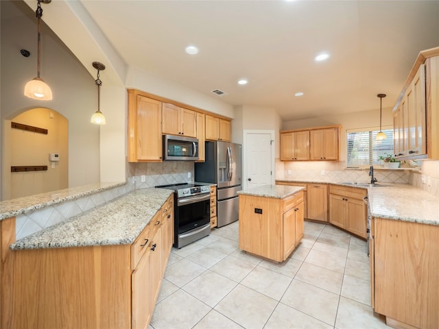 2912 Norton Ave, Lago Vista, TX 78645 - kitchen featuring appliances with stainless steel finishes, decorative backsplash, a peninsula, light brown cabinetry, and recessed lighting