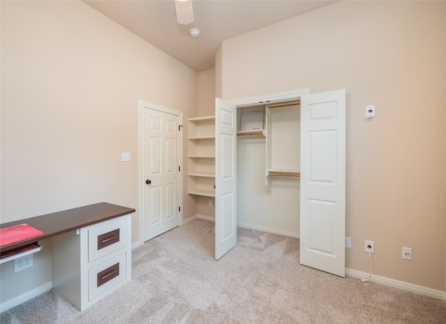 2912 Norton Ave, Lago Vista, TX 78645 - unfurnished bedroom with light carpet, a closet, and an office area