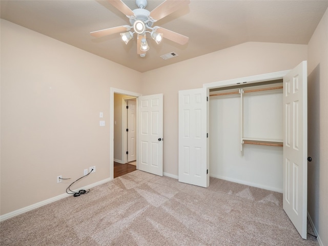 2912 Norton Ave, Lago Vista, TX 78645 - unfurnished bedroom with carpet flooring, a closet, a ceiling fan, and vaulted ceiling