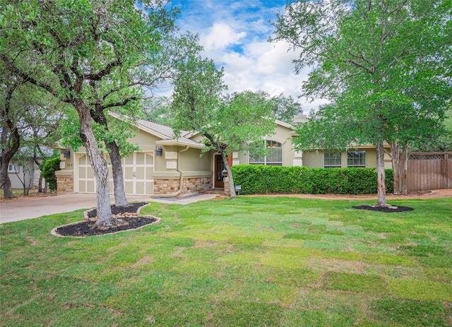 2912 Norton Ave, Lago Vista, TX 78645 - view of front of home with stucco siding, a garage, driveway, and stone siding