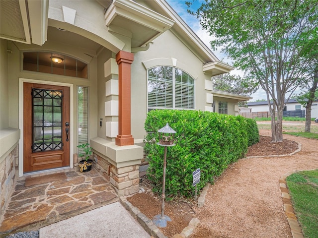 2912 Norton Ave, Lago Vista, TX 78645 - view of exterior entry featuring stucco siding and a porch