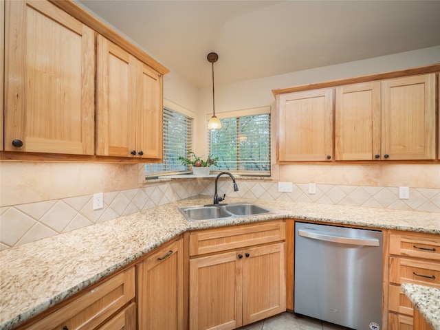 2912 Norton Ave, Lago Vista, TX 78645 - kitchen with stainless steel dishwasher, light brown cabinets, backsplash, and light stone countertops