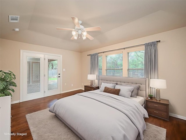 2912 Norton Ave, Lago Vista, TX 78645 - bedroom with access to exterior, multiple windows, and dark wood-style floors
