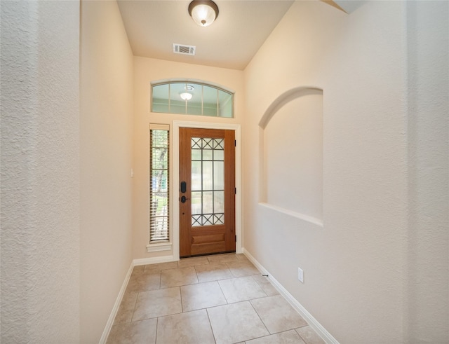 2912 Norton Ave, Lago Vista, TX 78645 - foyer with light tile patterned floors and baseboards