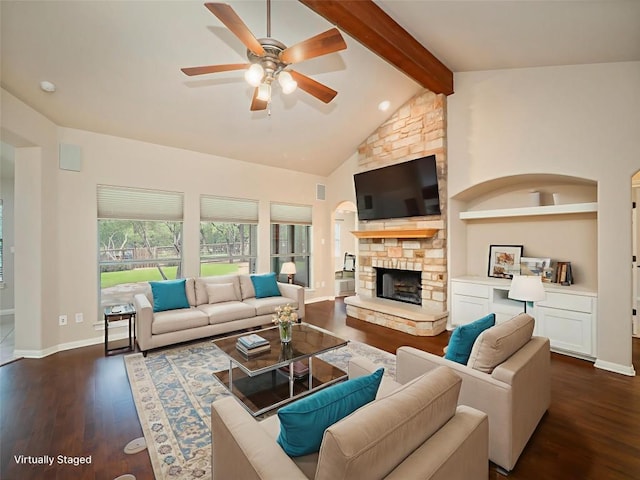 2912 Norton Ave, Lago Vista, TX 78645 - living room with dark wood-type flooring, beam ceiling, ceiling fan, a stone fireplace, and high vaulted ceiling