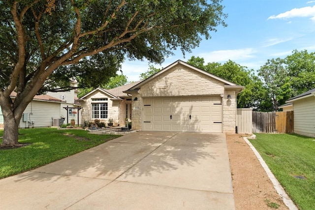 30310 Bumble Bee Dr, Georgetown, TX 78628 - ranch-style home with a front yard, fence, an attached garage, and stone siding