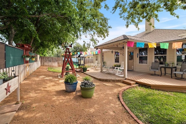 30310 Bumble Bee Dr, Georgetown, TX 78628 - view of yard featuring a wooden deck and a fenced backyard